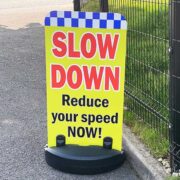 Pavement Sign - Slow Down Reduce Your Speed NOW!
